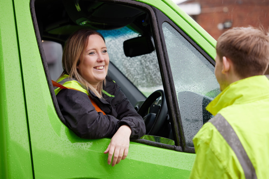 Customer delivery colleagues chatting through van window