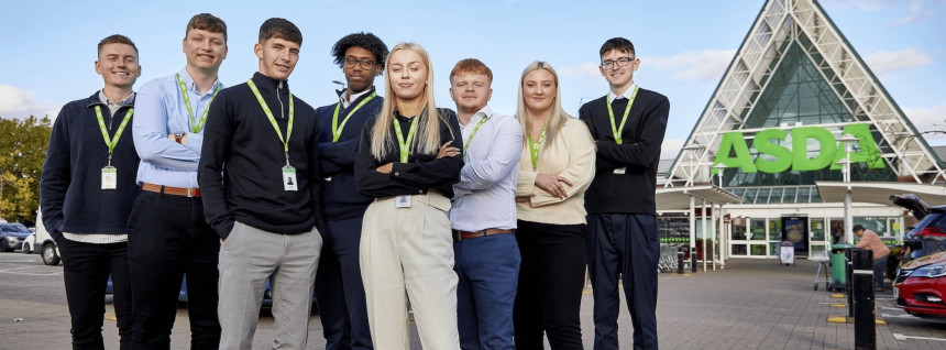 Group of young colleagues outside large Asda store