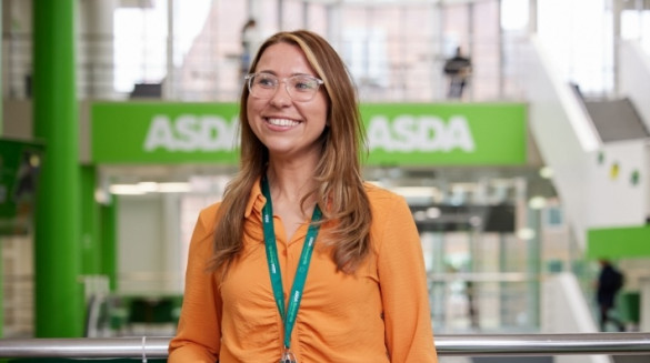 Colleague smiling inside Asda building