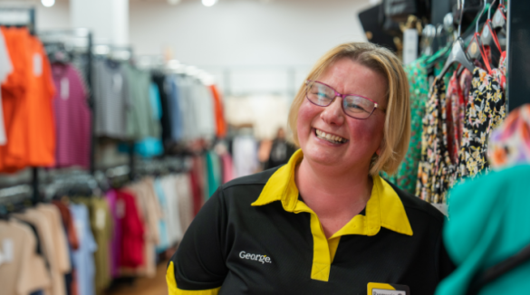 George colleague smiling in the clothing department.