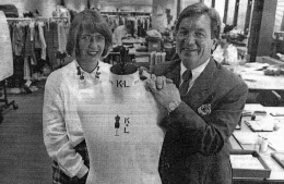 Historical colleagues posing by a mannequin in black and white