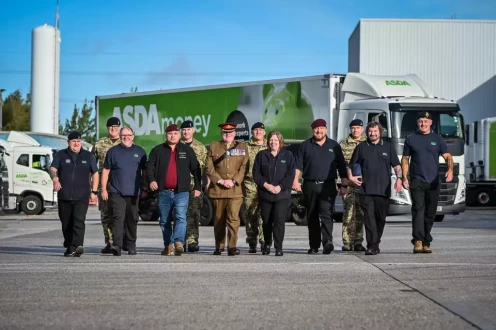 Group of Asda veterans and armed forces colleagues in front of lorry