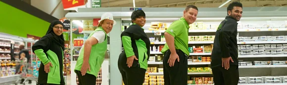 5 colleagues in a line slapping their back pockets