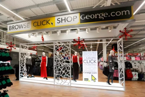 George section of store with banner saying ;browse, click, shop, George.com'