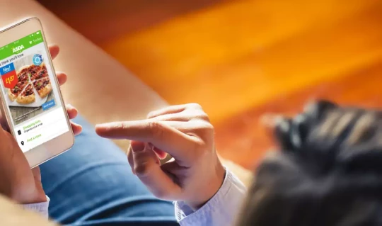 Customer using Asda website on smart phone