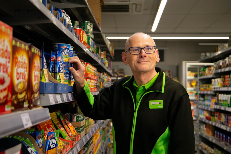 Asda Express colleague stocking shelves in store