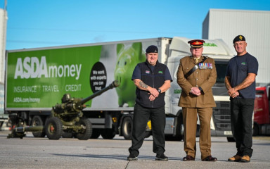 Colleagues in armed forced uniforms in front of Asda lorry