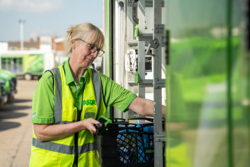 Customer delivery driver loading boxes into a lorry